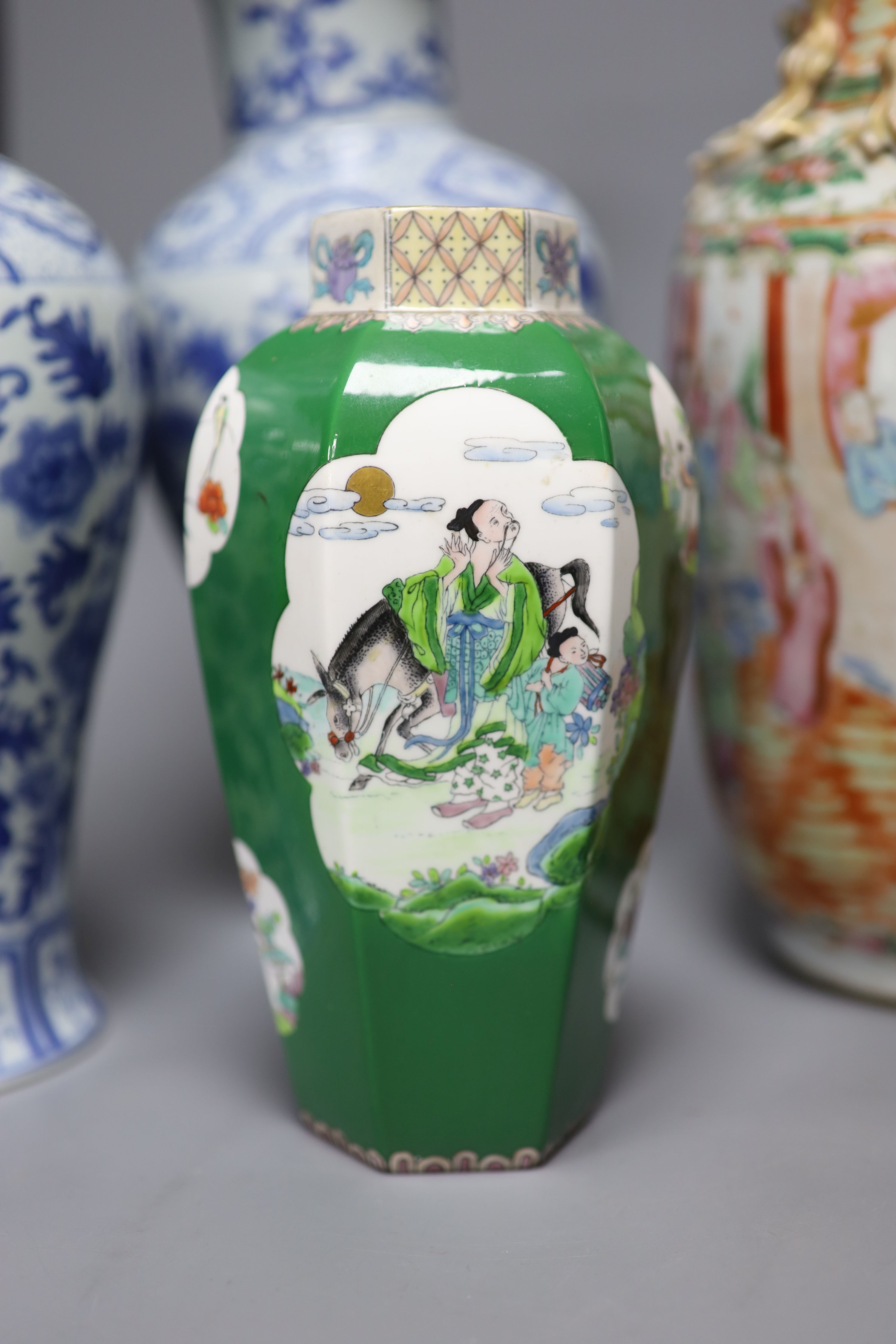 A Chinese famille rose Canton vase, a pair of blue and white vases and two others, tallest 35.5cm